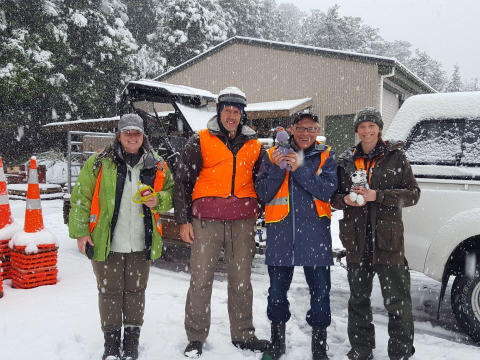 Outside the DOC office in Whakapapa Village after the web conference this morning - Marie, Andrew, Ruud, Jenny, and the ambassadors. Image: LEARNZ.