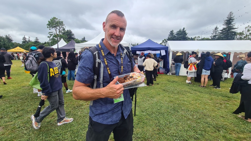 Image: Enjoying food at the festival by LEARNZ.