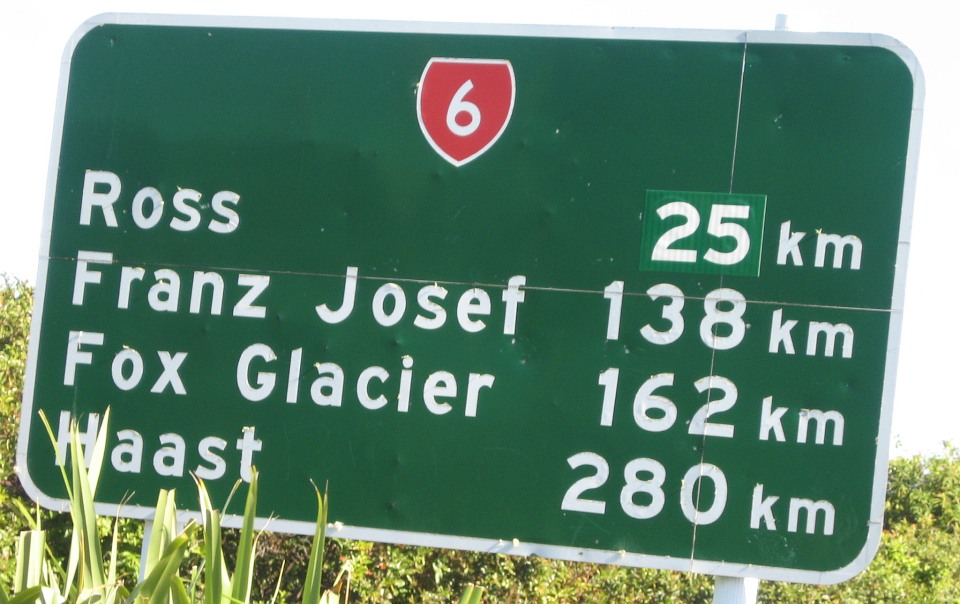 What historical European figures are these places named after? Note that this road sign doesn't have the official place name: Franz Josef / Waiau. Image: LEARNZ.