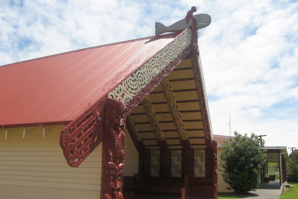 You may recognise this whare tipuna at Whāngārā from the movie Whale Rider. You can see how paua shell has been used to decorate its carvings. Image: LEARNZ