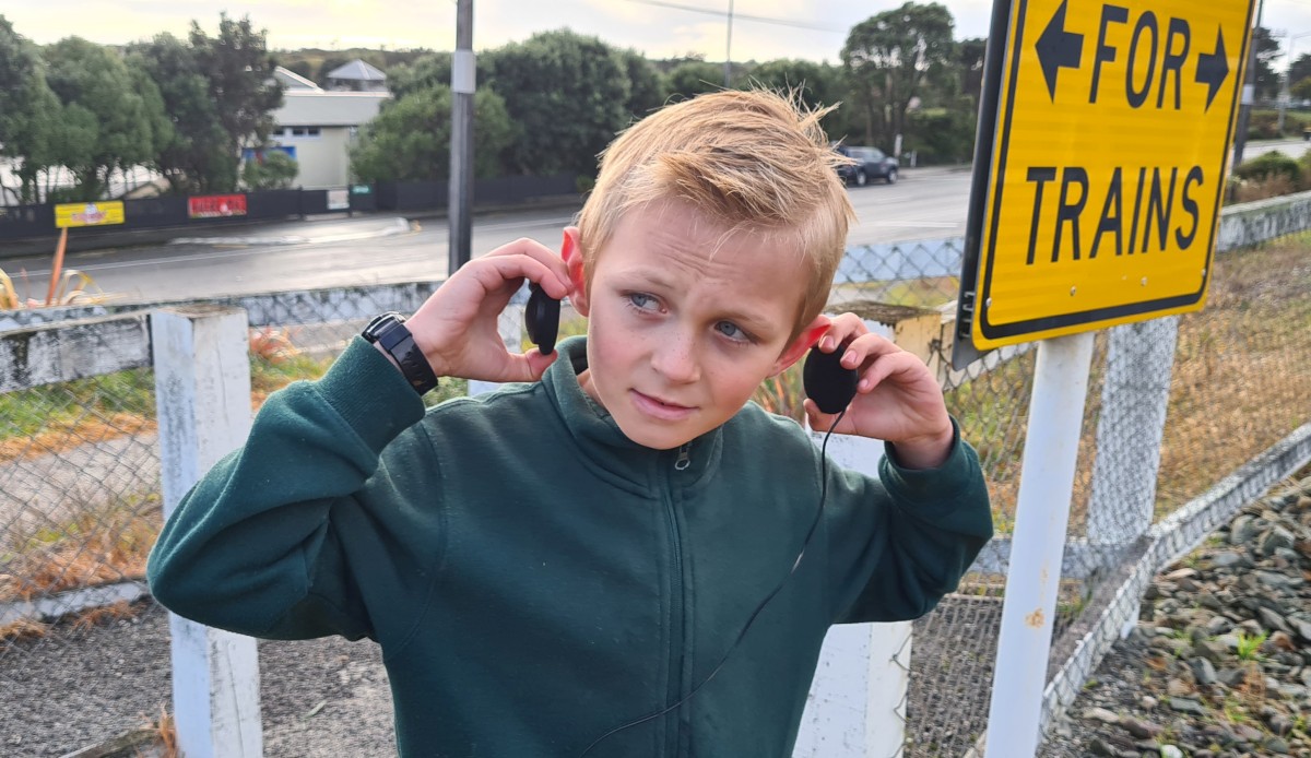 Remove headphones and stop, look, and listen for trains. Image: LEARNZ.–