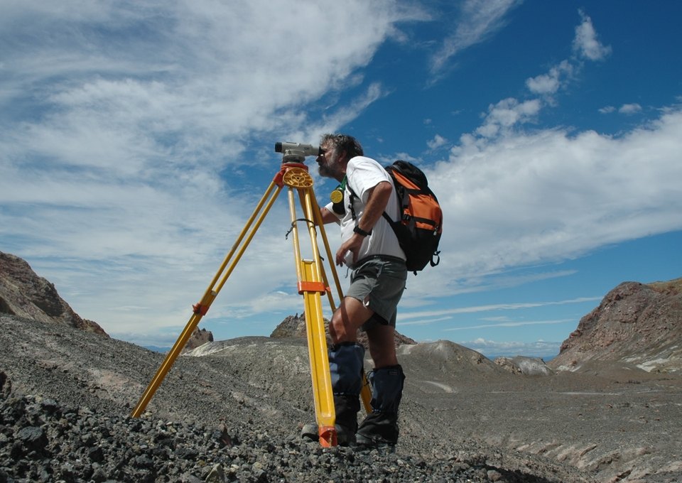 Brad Scott from GNS Science completes a survey to monitor changes in the ground caused by volcanic activity. Image: GNS Science.
